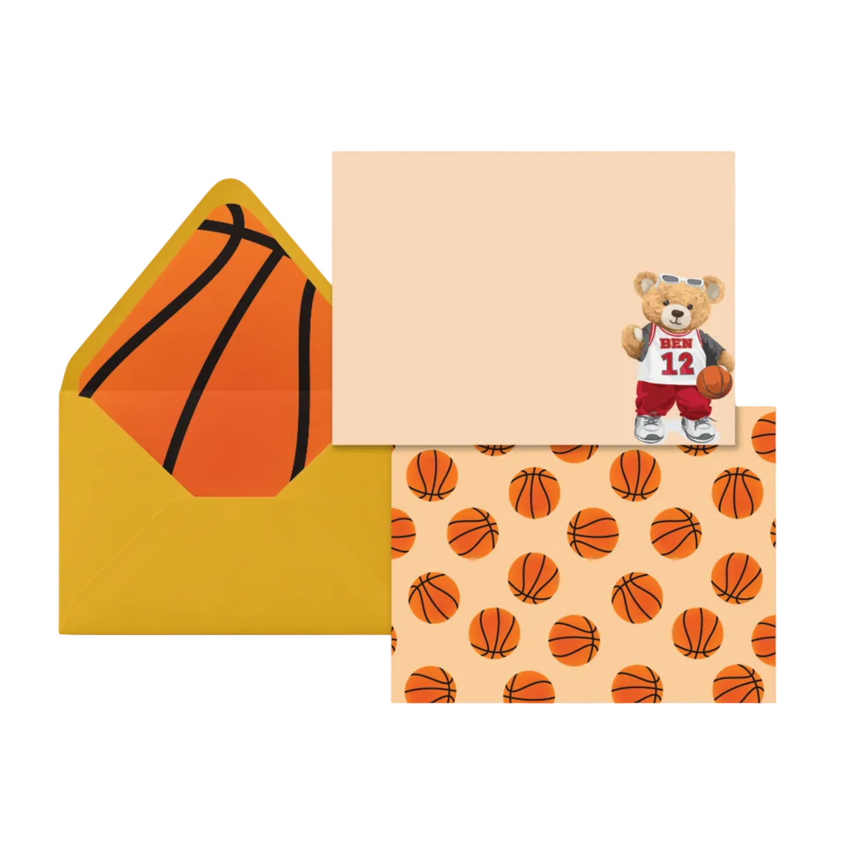 A basketball-themed stationery set featuring a yellow envelope with an orange basketball design, a blank peach note card, and a patterned card with orange basketballs on a peach background plus a small teddy bear wearing a red and white jersey.